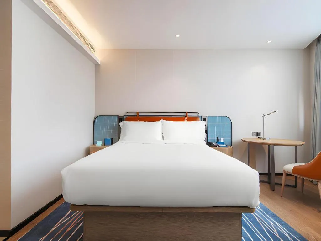 Bed in Echarm Hotel Nanjing Expo Center Olympic East Metro Station