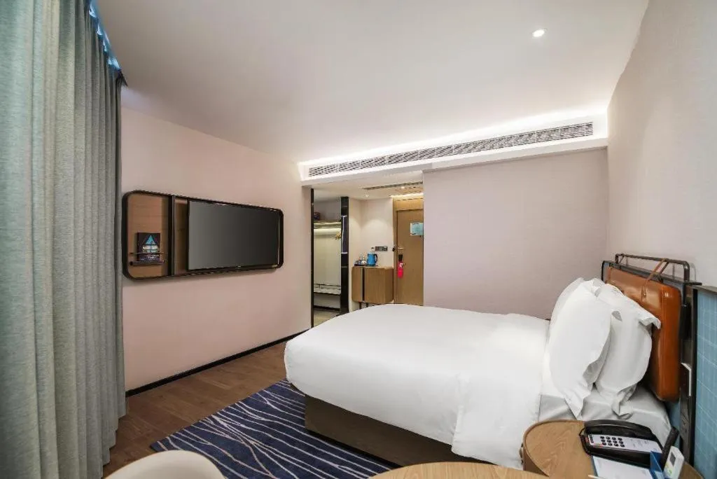 Bed in Echarm Hotel Nanjing Expo Center Olympic East Metro Station