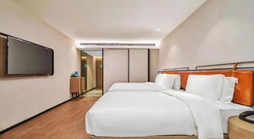 Bed in Echarm Hotel Nanjing Expo Center Olympic East Metro Station