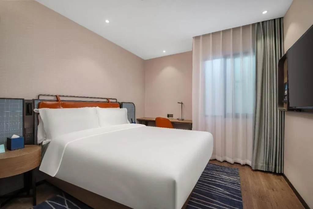 Bed in Echarm Hotel Nanjing Expo Center Olympic East Metro Station