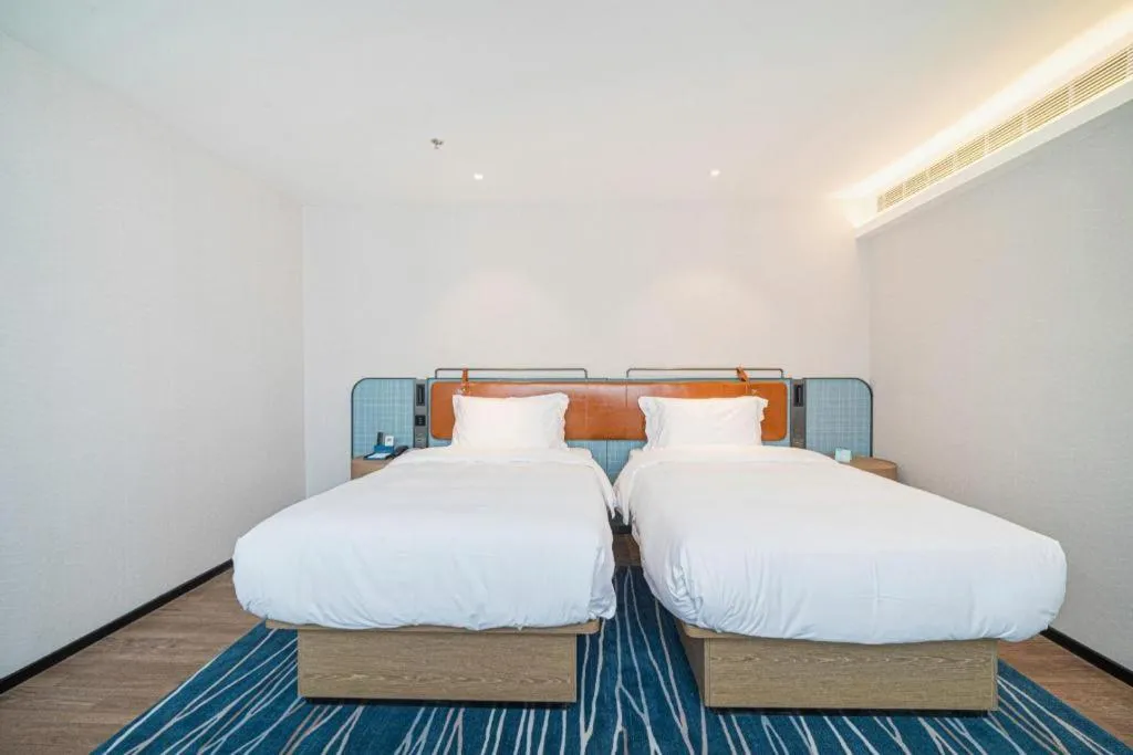 Bed in Echarm Hotel Nanjing Expo Center Olympic East Metro Station