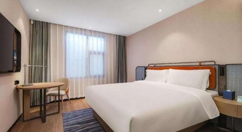 Bed in Echarm Hotel Nanjing Expo Center Olympic East Metro Station