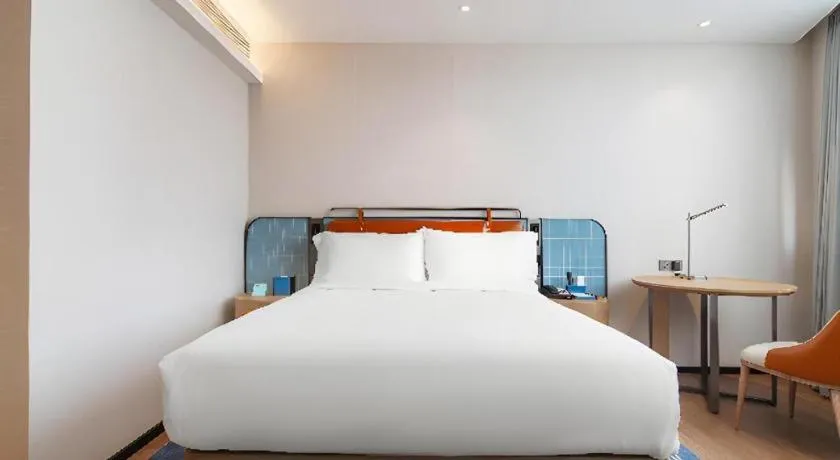 Bed in Echarm Hotel Nanjing Expo Center Olympic East Metro Station