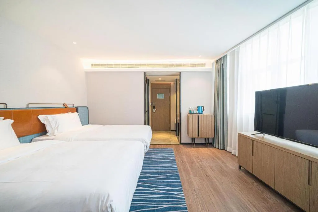 Bed in Echarm Hotel Nanjing Expo Center Olympic East Metro Station