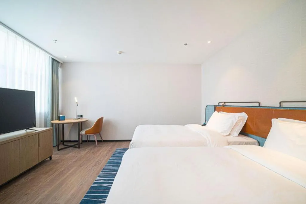 Bed in Echarm Hotel Nanjing Expo Center Olympic East Metro Station