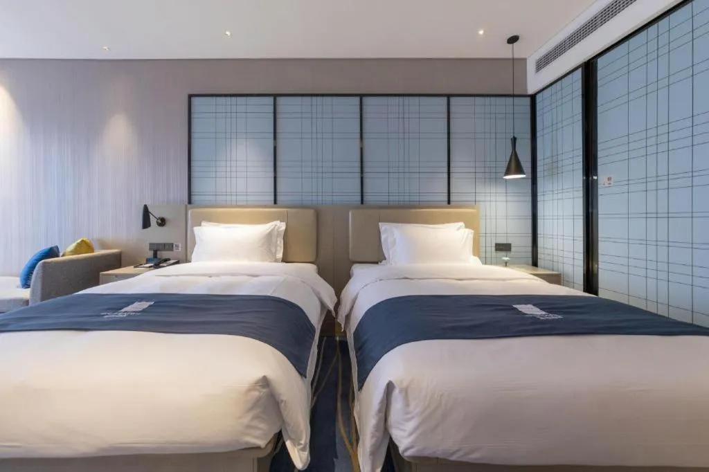 Bed in Echarm Hotel Wuhan Huashan