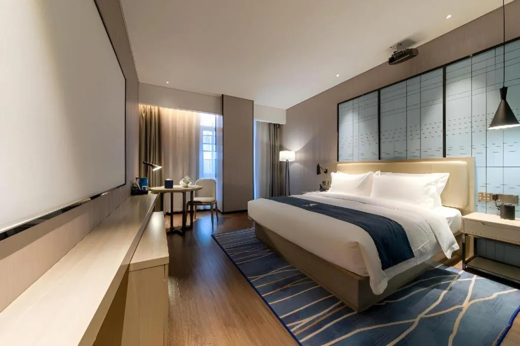 Bed in Echarm Hotel Wuhan Huashan