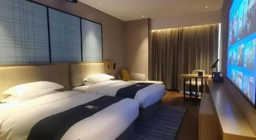 Bed in Echarm Hotel Wuhan Huashan