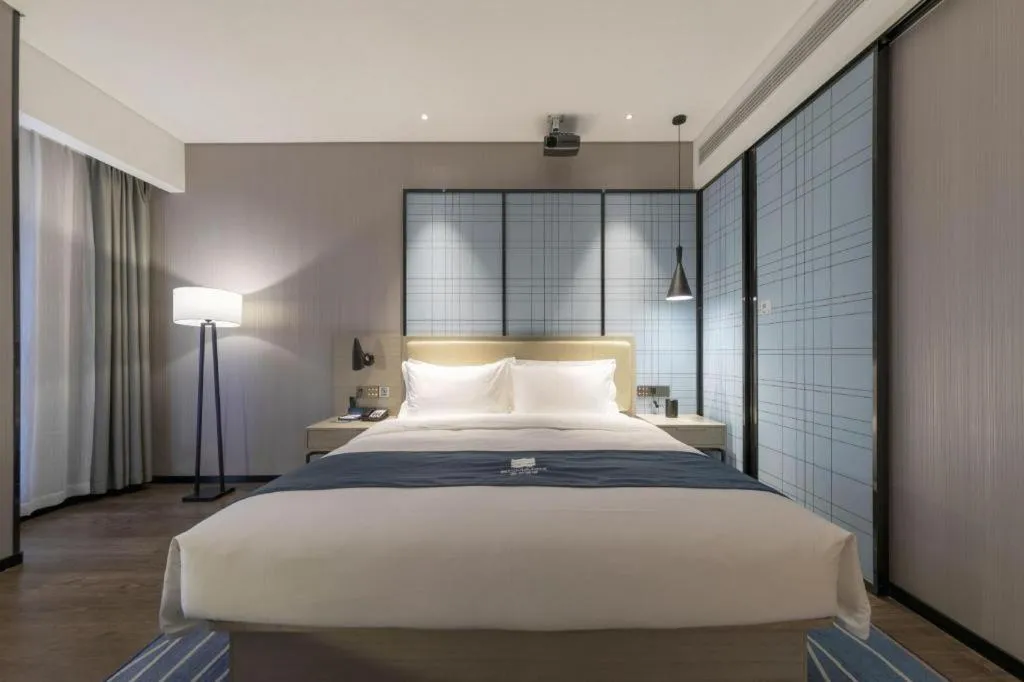 Bed in Echarm Hotel Wuhan Huashan