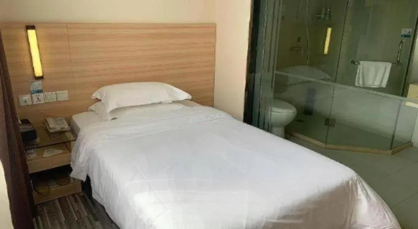 Bed in City Comfort Inn Yichang Wanda Plaza Yunhe Park