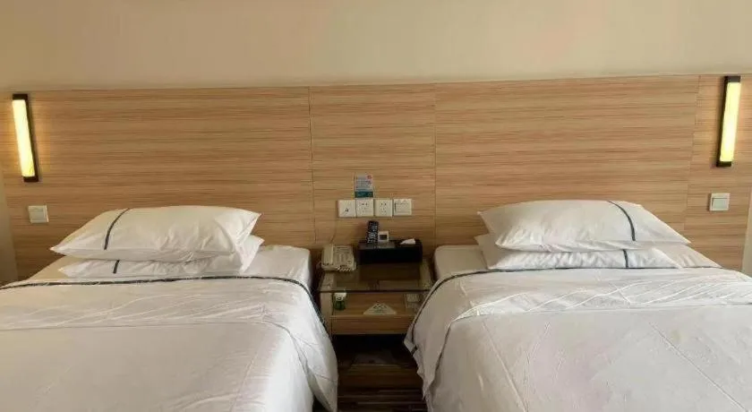 Bed in City Comfort Inn Yichang Wanda Plaza Yunhe Park