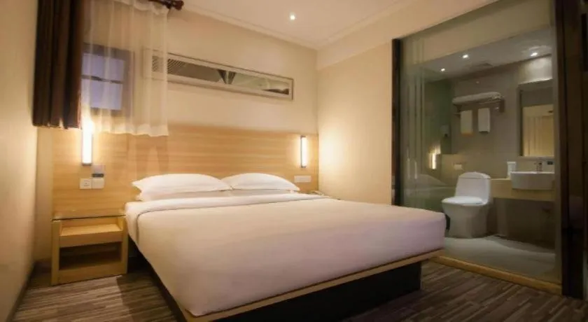 Bed in City Comfort Inn Yichang Wanda Plaza Yunhe Park