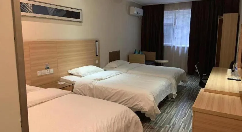 Bed in City Comfort Inn Yichang Wanda Plaza Yunhe Park