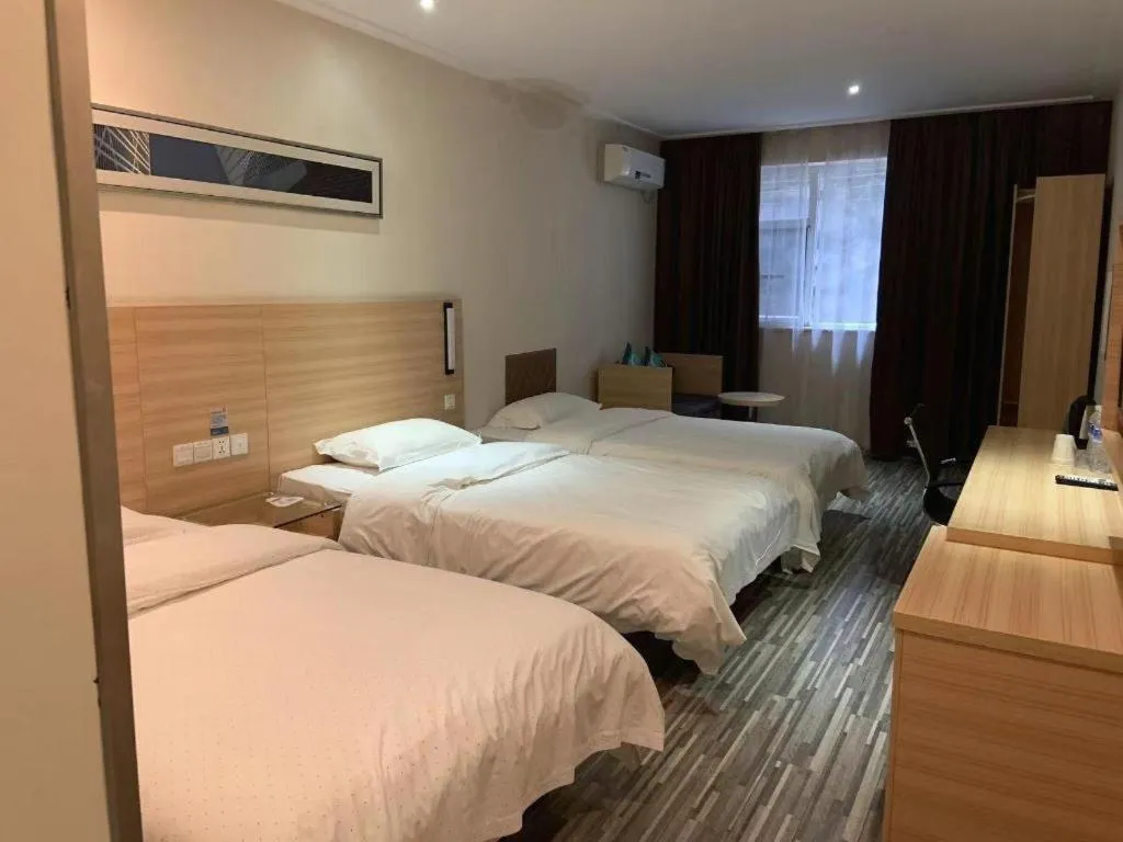 Bed in City Comfort Inn Yichang Wanda Plaza Yunhe Park