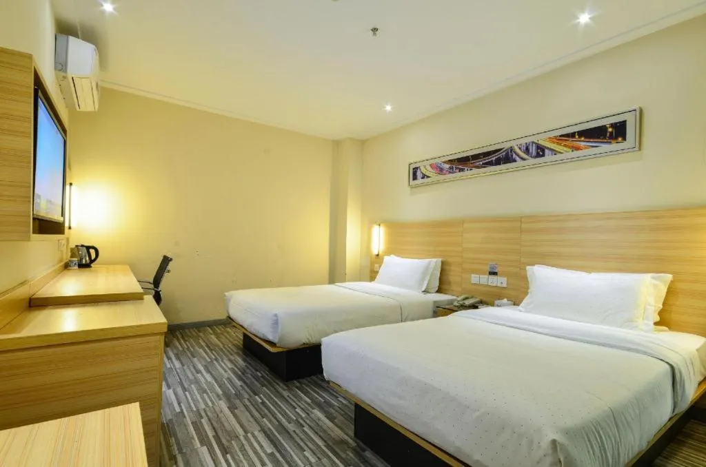 Bed in City Comfort Inn Yichang Wanda Plaza Yunhe Park