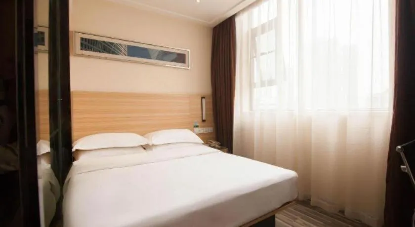 Bed in City Comfort Inn Yichang Wanda Plaza Yunhe Park