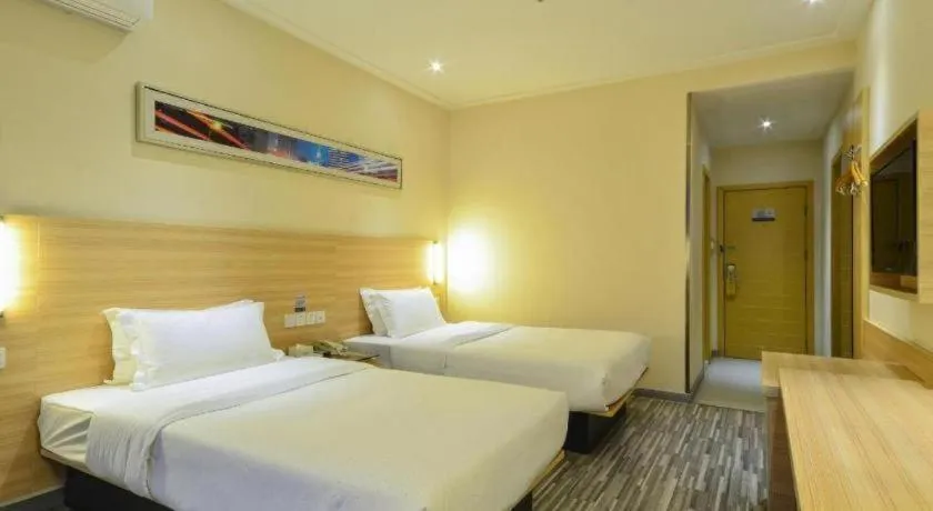 Bed in City Comfort Inn Yichang Wanda Plaza Yunhe Park