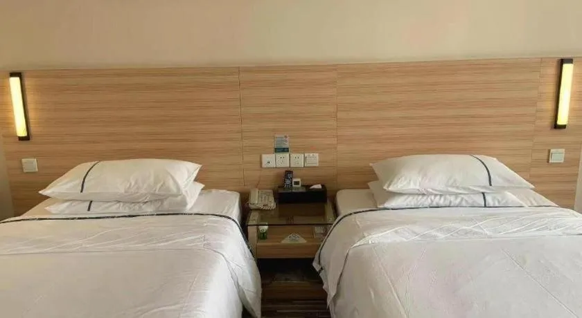 Bed in City Comfort Inn Yichang Wanda Plaza Yunhe Park