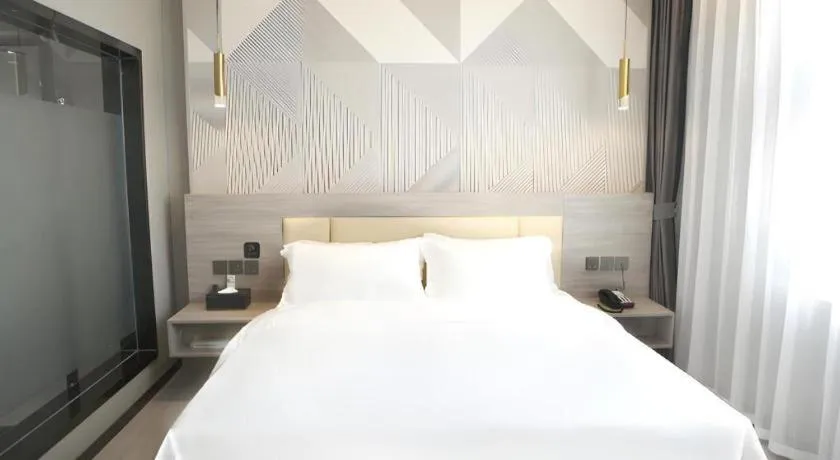 Bed in Borrman Hotel Pingyi Beifang Shicaicheng Mingde Road