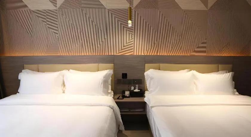 Bed in Borrman Hotel Pingyi Beifang Shicaicheng Mingde Road