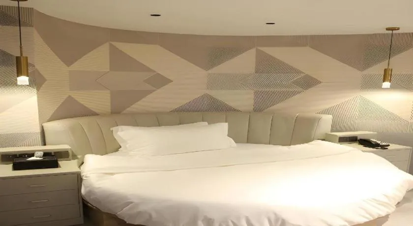 Bed in Borrman Hotel Pingyi Beifang Shicaicheng Mingde Road