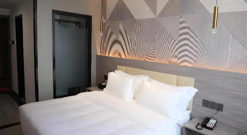 Bed in Borrman Hotel Pingyi Beifang Shicaicheng Mingde Road