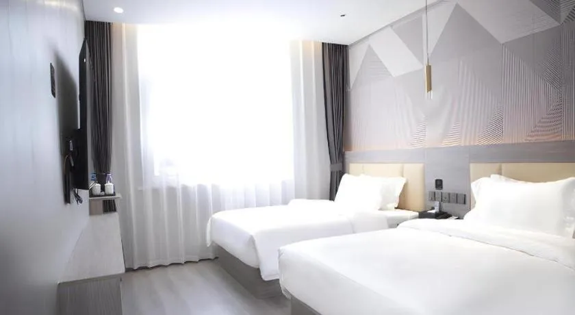 Bed in Borrman Hotel Pingyi Beifang Shicaicheng Mingde Road