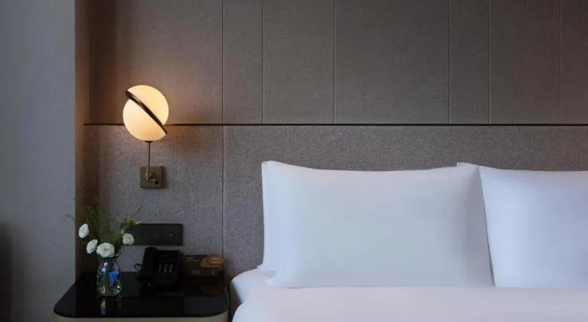 Bed in Onejee Hotel Shenzhen