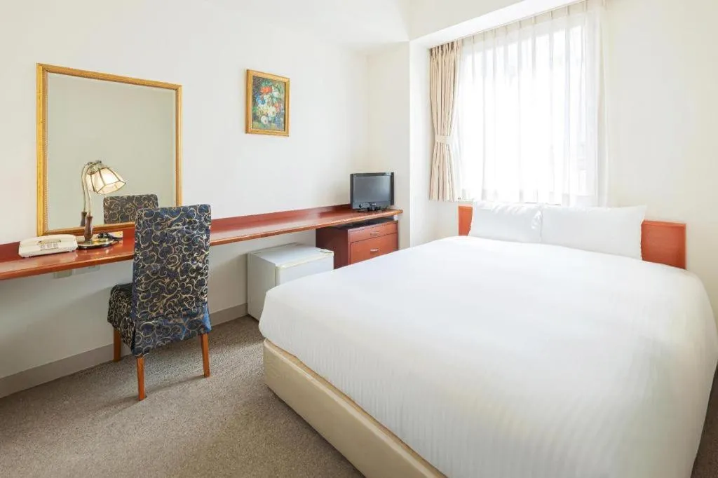 Bed in Ginza Bellevue Hotel