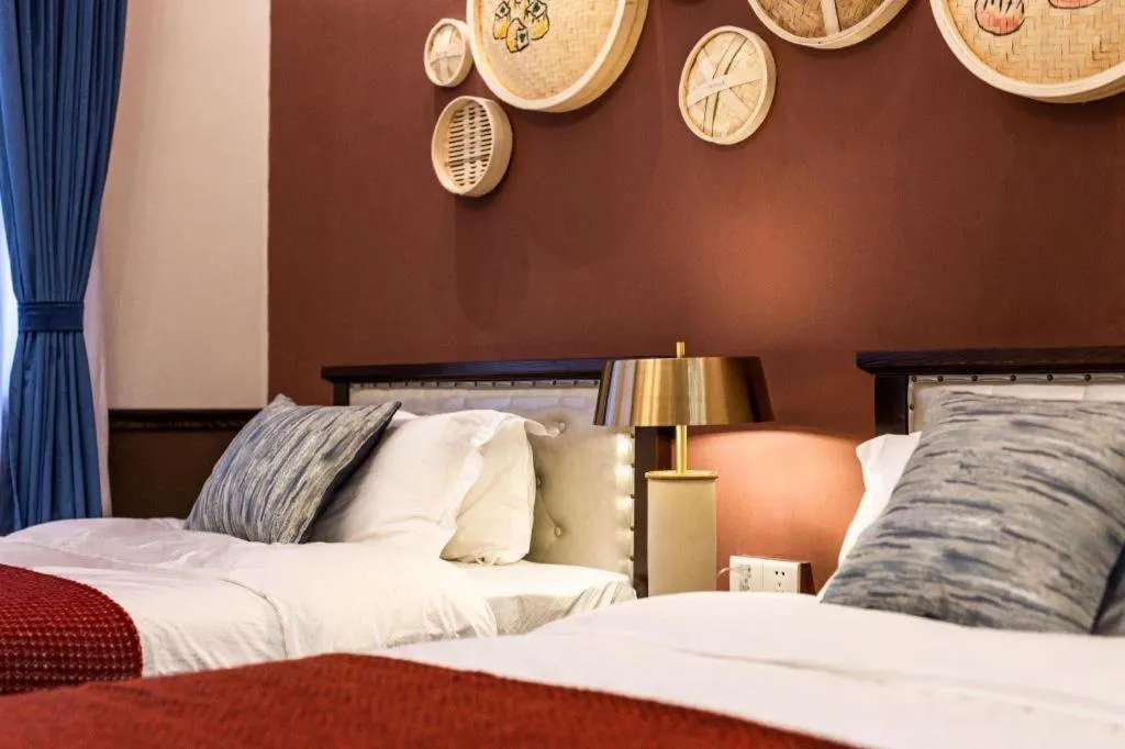 Bed in Origin Antique House and Hotel