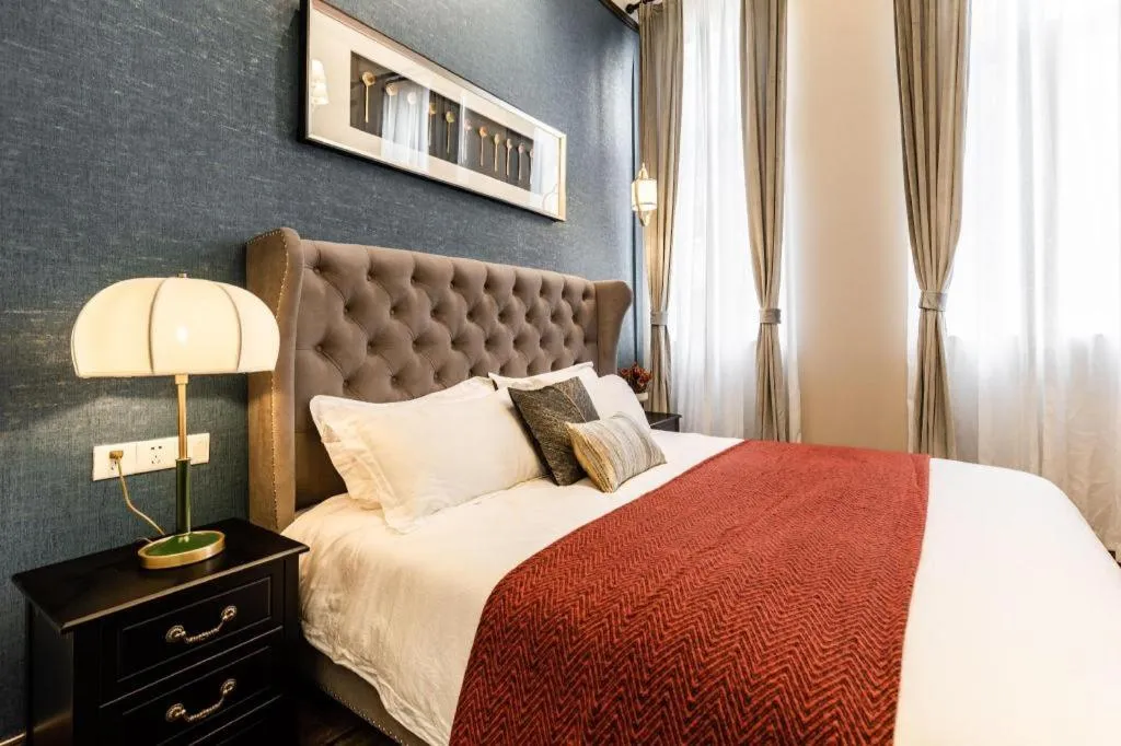 Bed in Origin Antique House and Hotel