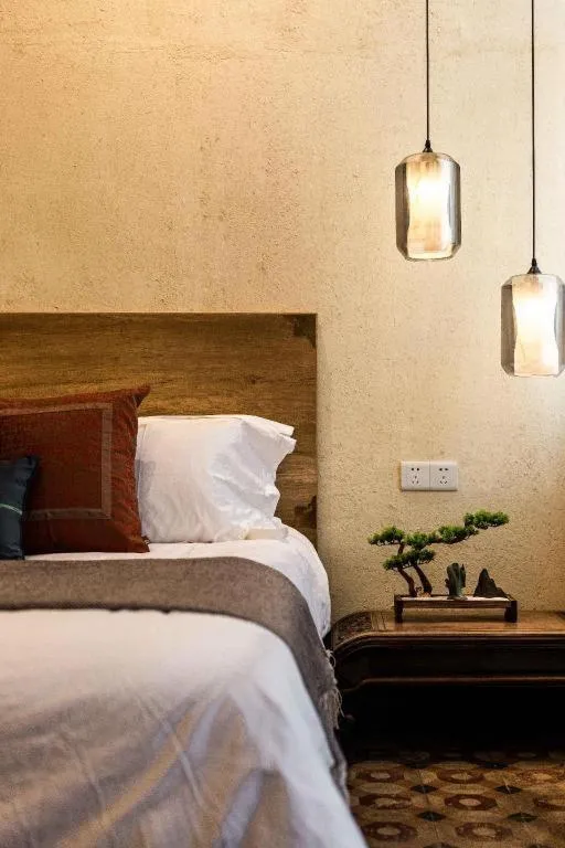 Bed in Origin Antique House and Hotel