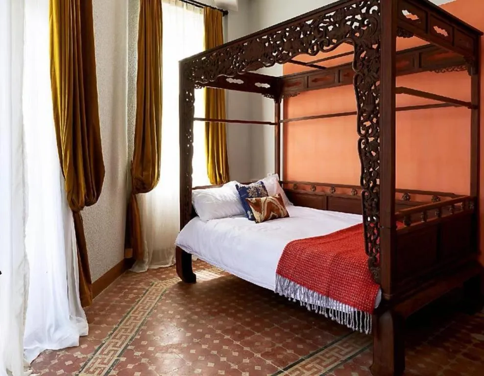 Bed in Origin Antique House and Hotel