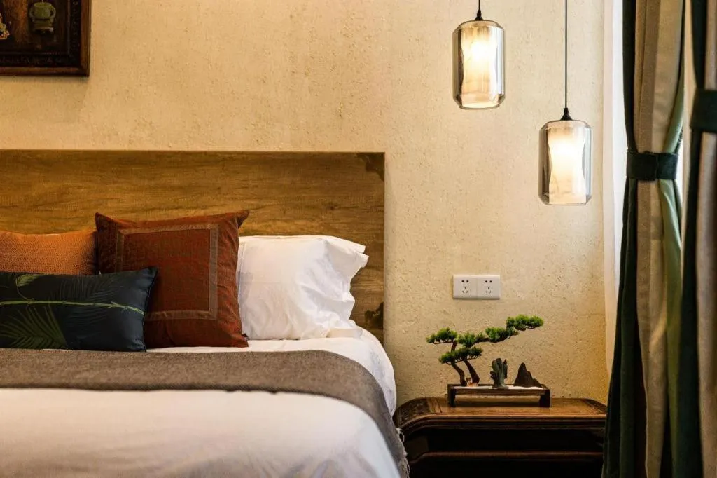 Bed in Origin Antique House and Hotel