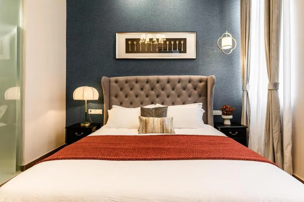 Bed in Origin Antique House and Hotel