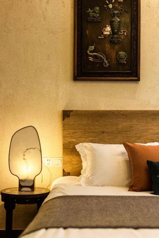 Bed in Origin Antique House and Hotel