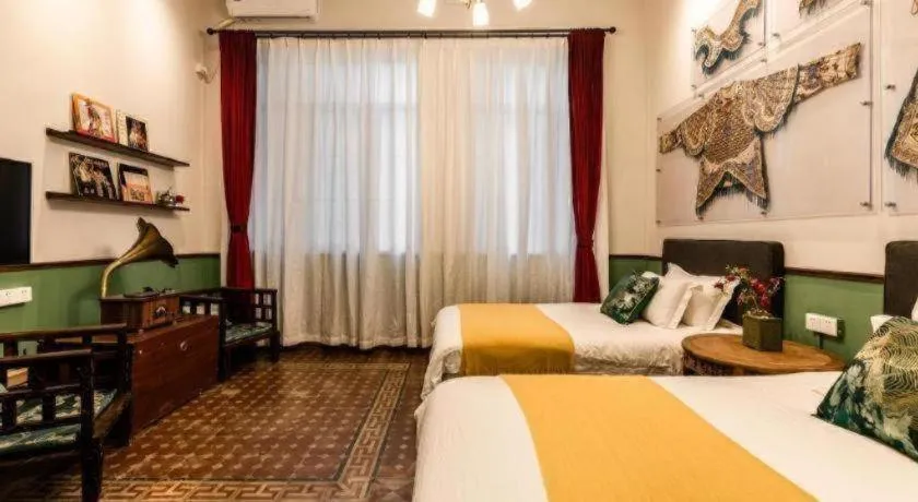 Bed in Origin Antique House and Hotel