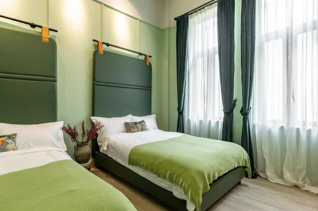 Bed in Origin Antique House and Hotel