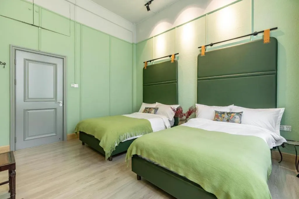 Bed in Origin Antique House and Hotel