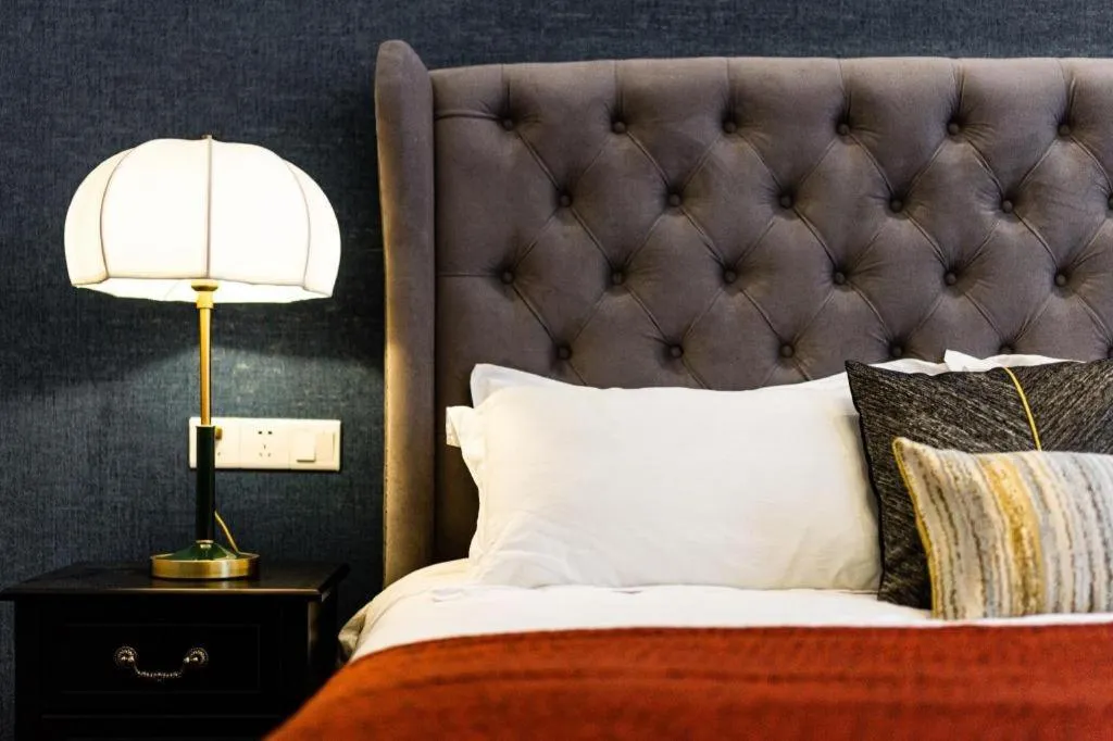 Bed in Origin Antique House and Hotel