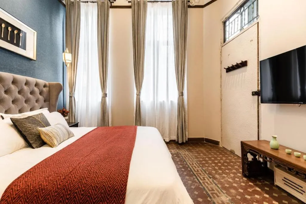 Bed in Origin Antique House and Hotel