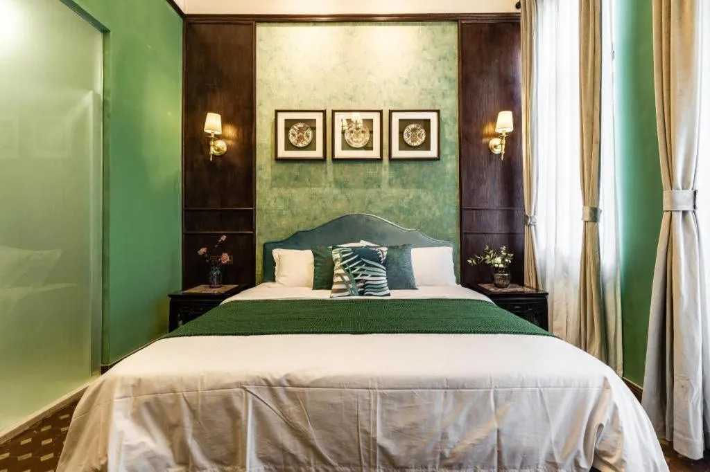 Bed in Origin Antique House and Hotel