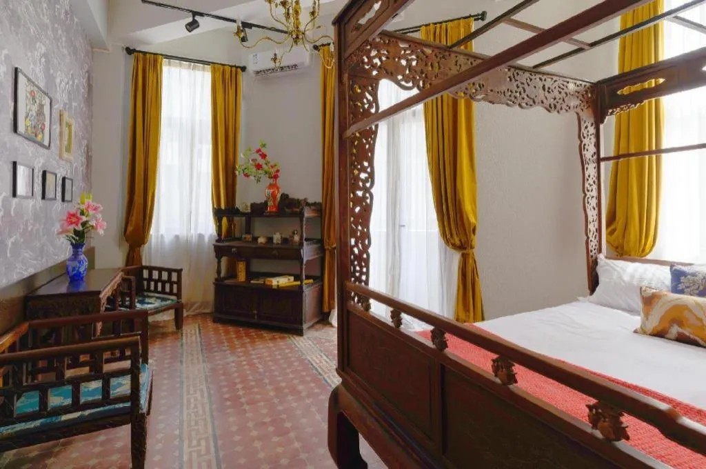 Bed in Origin Antique House and Hotel
