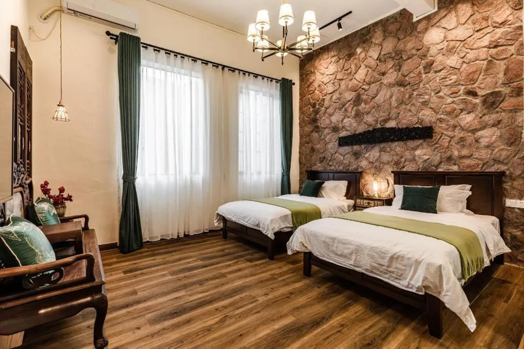 Bed in Origin Antique House and Hotel