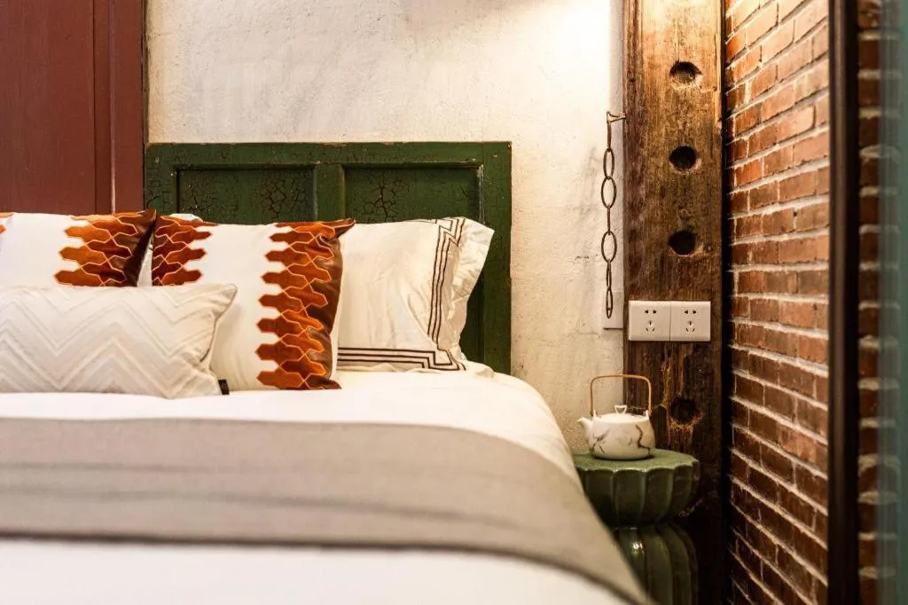 Bed in Origin Antique House and Hotel