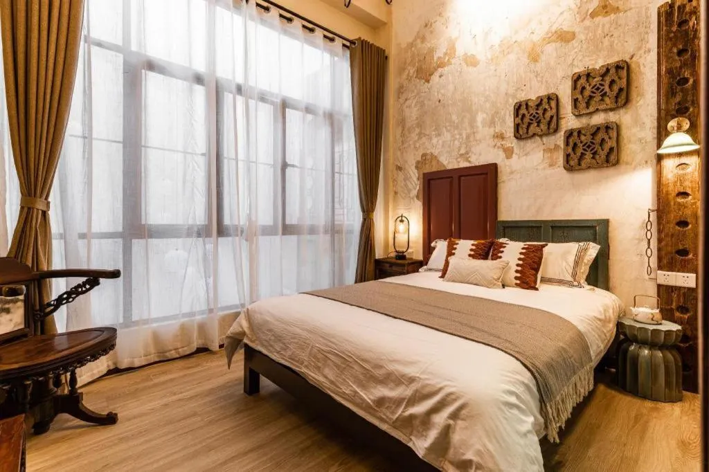 Bed in Origin Antique House and Hotel