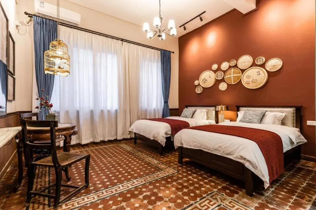 Bed in Origin Antique House and Hotel