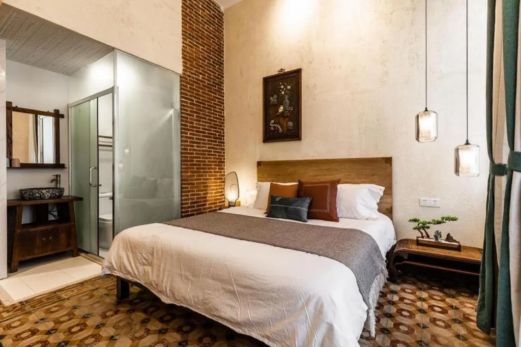 Bed in Origin Antique House and Hotel