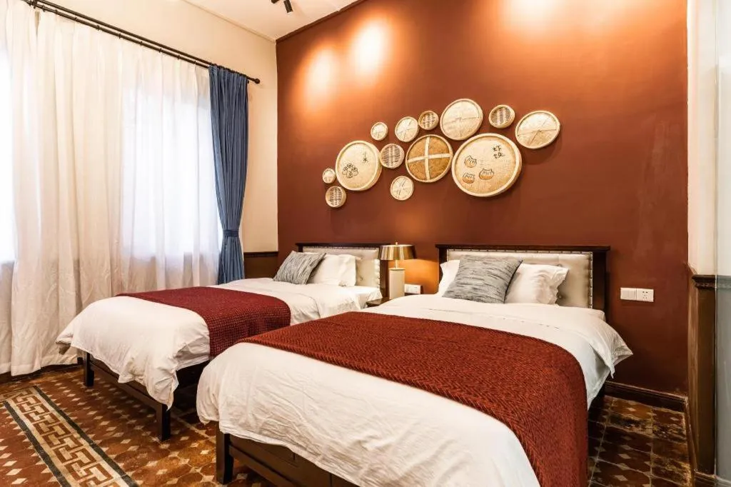 Bed in Origin Antique House and Hotel