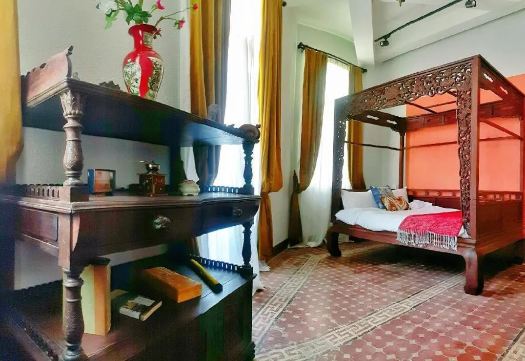 Bed in Origin Antique House and Hotel